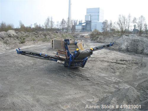 Used Fintec 640 3-way heavy duty scalping screen, mobile, with steel apron feeder, screen box 3650 x 1500 mm (12' x 5'), top deck with tines 100 mm (4"), drum diameter 400 mm (16"). 74 kW (99 hp) die...