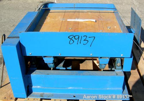 USED: Gaynes Engineering shaker table, model V100, carbon steel. 24" wide x 28" long wooden deck, approximate 100 pound capacity. Driven by an approximate 1/2 hp motor.