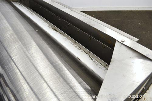 Used Hydrocyclonics Roto Strainer, Model 2572, 304 Stainless Steel. Approximate 25" diameter x 72" wide wedge wire screen. Driven by a .44-.5hp gear motor. Includes a bottom holding tank, and a manua...