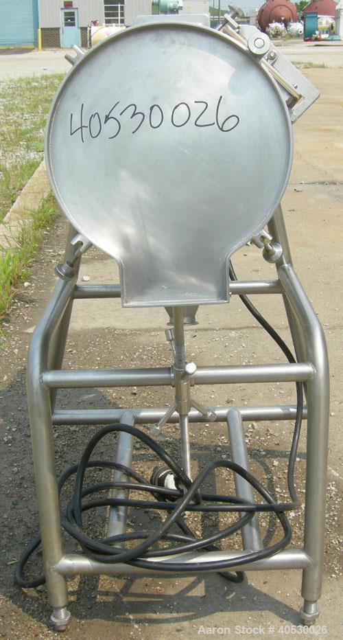 Used Rotary Screener/Separator, 304 stainless steel. Approximate 5" diameter x 16" long filter chamber with cloth. Approximate 13" diameter x 17 1/2" long housing with spray manifold. 1 1/2" tri-clam...