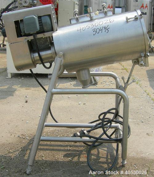 Used Rotary Screener/Separator, 304 stainless steel. Approximate 5" diameter x 16" long filter chamber with cloth. Approximate 13" diameter x 17 1/2" long housing with spray manifold. 1 1/2" tri-clam...