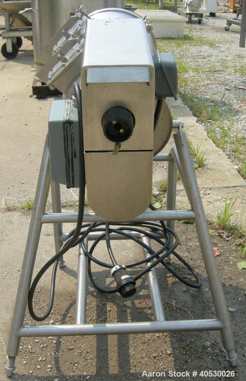 Used Rotary Screener/Separator, 304 stainless steel. Approximate 5" diameter x 16" long filter chamber with cloth. Approximate 13" diameter x 17 1/2" long housing with spray manifold. 1 1/2" tri-clam...