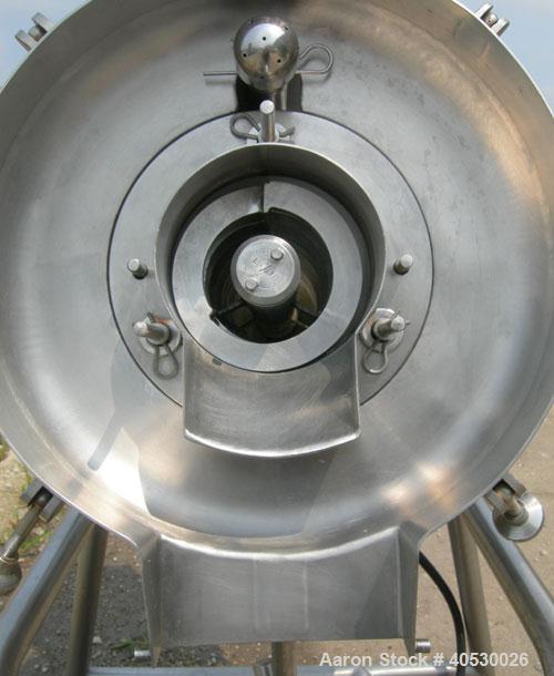 Used Rotary Screener/Separator, 304 stainless steel. Approximate 5" diameter x 16" long filter chamber with cloth. Approximate 13" diameter x 17 1/2" long housing with spray manifold. 1 1/2" tri-clam...
