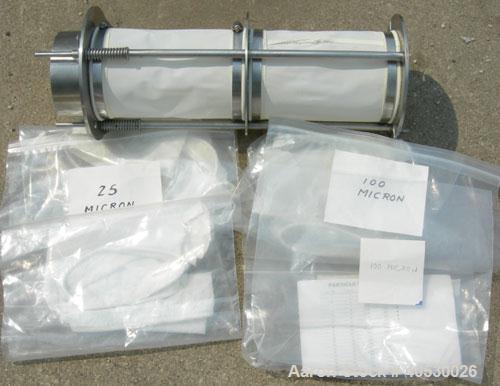 Used Rotary Screener/Separator, 304 stainless steel. Approximate 5" diameter x 16" long filter chamber with cloth. Approximate 13" diameter x 17 1/2" long housing with spray manifold. 1 1/2" tri-clam...