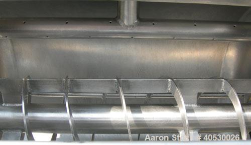 Used Rotary Screener/Separator, 304 stainless steel. Approximate 5" diameter x 16" long filter chamber with cloth. Approximate 13" diameter x 17 1/2" long housing with spray manifold. 1 1/2" tri-clam...
