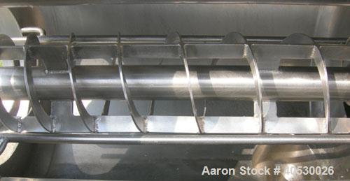 Used Rotary Screener/Separator, 304 stainless steel. Approximate 5" diameter x 16" long filter chamber with cloth. Approximate 13" diameter x 17 1/2" long housing with spray manifold. 1 1/2" tri-clam...
