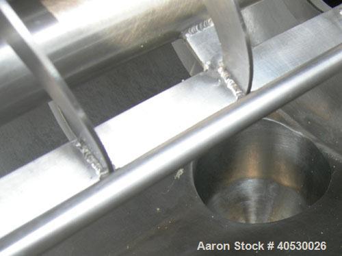 Used Rotary Screener/Separator, 304 stainless steel. Approximate 5" diameter x 16" long filter chamber with cloth. Approximate 13" diameter x 17 1/2" long housing with spray manifold. 1 1/2" tri-clam...