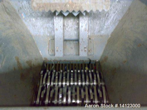 Used ARP twin roll shredder, type CS5000. Material of construction is carbon steel on product contact parts. (2) 10.53" (270mm) diameter x 19.5" (500mm) straight side rolls with knives. Driven via a ...