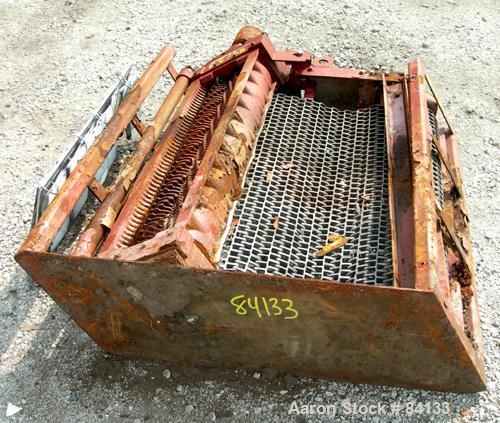 USED: JWC Environmental twin shaft open Channel Muffin Monster shredder, model 30003-40. Carbon steel. (2) rows of 4" diameter x 40" wide x 1/4" thick intermeshing cutters. Rated approximately 2000 g...