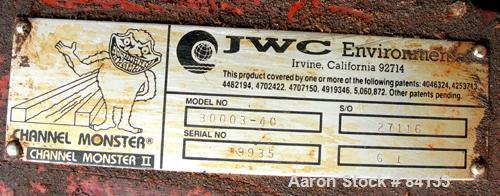 USED: JWC Environmental twin shaft open Channel Muffin Monster shredder, model 30003-40. Carbon steel. (2) rows of 4" diameter x 40" wide x 1/4" thick intermeshing cutters. Rated approximately 2000 g...