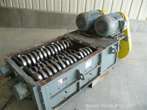 USED: 50 hp SSI shredder, model Q55-ED(40), ram feed. Previously used for medical waste shredding. Low hours.