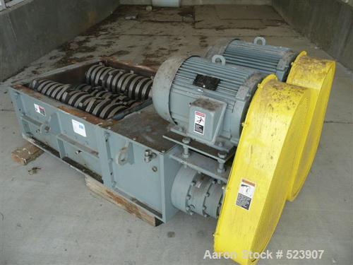 USED: 50 hp SSI shredder, model Q55-ED(40), ram feed. Previously used for medical waste shredding. Low hours.
