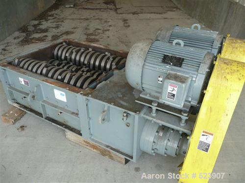 USED: 50 hp SSI shredder, model Q55-ED(40), ram feed. Previously used for medical waste shredding. Low hours.