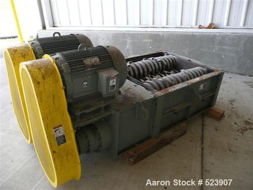 USED: 50 hp SSI shredder, model Q55-ED(40), ram feed. Previously used for medical waste shredding. Low hours.