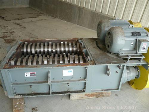 USED: 50 hp SSI shredder, model Q55-ED(40), ram feed. Previously used for medical waste shredding. Low hours.