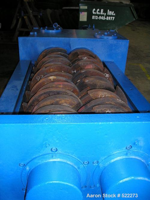 USED: Shred Tech ST100 shredder. Cutting chamber is 62" x 32", dual shaft, slow speed shear type, two 50 hp drives.