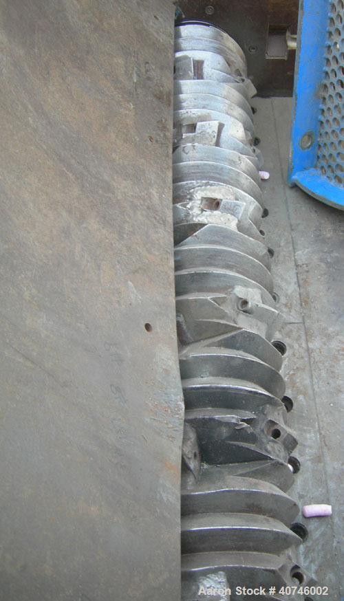 Used Vecoplan single shaft shredder, model VAZ 120/105C, carbon steel. Approximately 8" diameter x 42 1/4" wide rotor with bolt-on cutters. 42 3/16" x 48 7/8" feed opening with 43" tall bolt on hoppe...