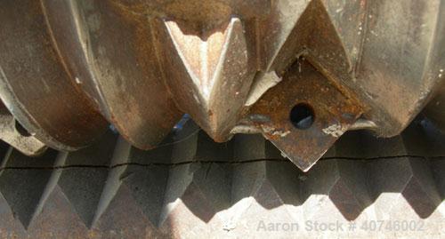 Used Vecoplan single shaft shredder, model VAZ 120/105C, carbon steel. Approximately 8" diameter x 42 1/4" wide rotor with bolt-on cutters. 42 3/16" x 48 7/8" feed opening with 43" tall bolt on hoppe...