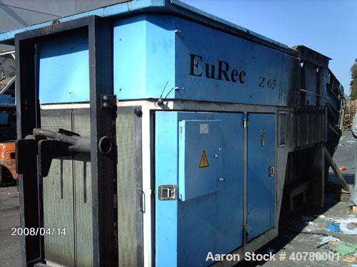 Used Eurec Shredder, model Z65/165. (2) 110 kW (145 hp) motors. Outside dimensions 3400 x 6000 (8700 with open feeder) x 3200. Used for foil shredding. Output 4 t/hour.