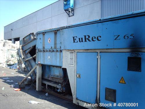 Used Eurec Shredder, model Z65/165. (2) 110 kW (145 hp) motors. Outside dimensions 3400 x 6000 (8700 with open feeder) x 3200. Used for foil shredding. Output 4 t/hour.