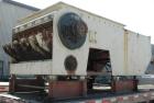 Used Holzmag Single Roll Shredder. Material of construction is carbon steel. 23.4” (600 mm) diameter x 66” (1690 mm) straight side roll with interchangeable knives. Hydraulic ram. Screen with 1.17” x...