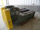 USED: 50 hp SSI shredder, model Q55-ED(40), ram feed. Previously used for medical waste shredding. Low hours.