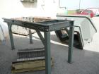 USED: 50 hp SSI shredder, model Q55-ED(40), ram feed. Previously used for medical waste shredding. Low hours.