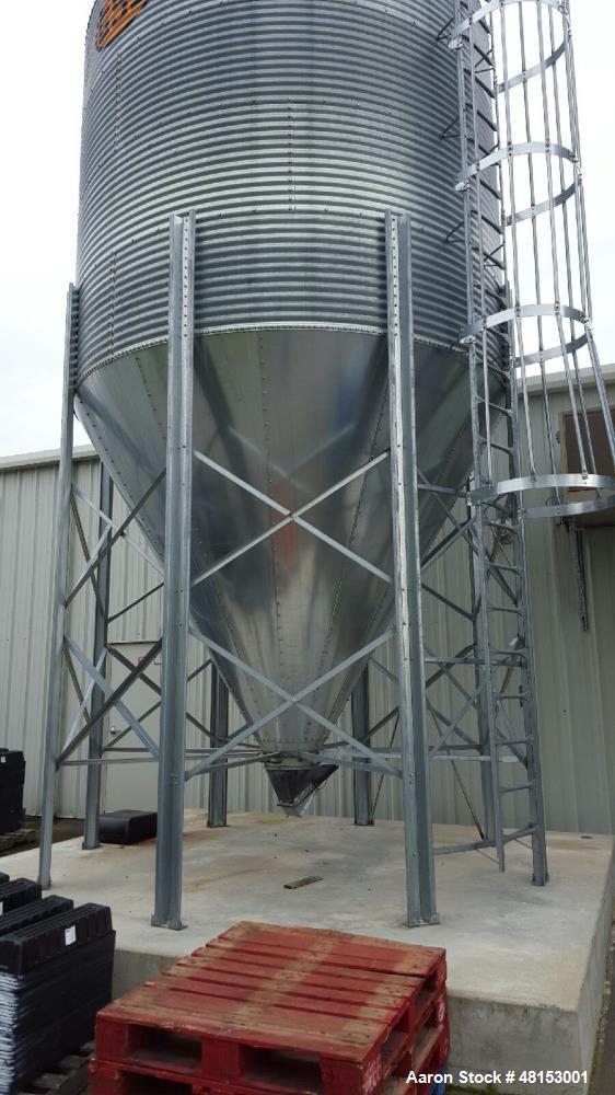 Used GSI Corrugated Silo, Model 12-4-60-16 . 1,706 cubic foot capacity. Galvanized steel. 12' diameter x 25' 10" high. Cone bottom. 60 deg cone. Outside ladder with cage.
