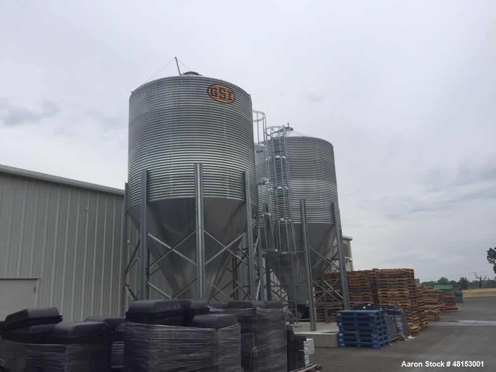 Used GSI Corrugated Silo, Model 12-4-60-16 . 1,706 cubic foot capacity. Galvanized steel. 12' diameter x 25' 10" high. Cone bottom. 60 deg cone. Outside ladder with cage.