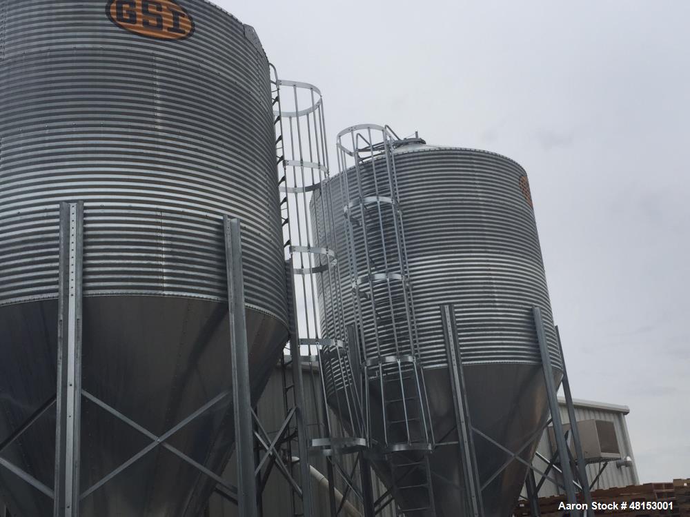 Used GSI Corrugated Silo, Model 12-4-60-16 . 1,706 cubic foot capacity. Galvanized steel. 12' diameter x 25' 10" high. Cone bottom. 60 deg cone. Outside ladder with cage.