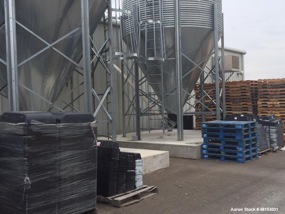 Used GSI Corrugated Silo, Model 12-4-60-16 . 1,706 cubic foot capacity. Galvanized steel. 12' diameter x 25' 10" high. Cone bottom. 60 deg cone. Outside ladder with cage.