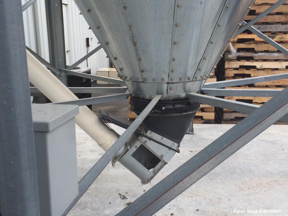 Used GSI Corrugated Silo, Model 12-4-60-16 . 1,706 cubic foot capacity. Galvanized steel. 12' diameter x 25' 10" high. Cone bottom. 60 deg cone. Outside ladder with cage.