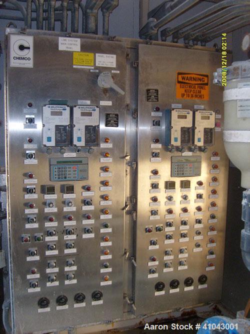Used Chemco Dry Bulk Storage Silos. System includes 3 silos, 11' diameter x 32' tall each, stair tower and catwalks. Previously used to store and mix lime and powdered activated carbon.