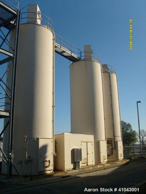 Used Chemco Dry Bulk Storage Silos. System includes 3 silos, 11' diameter x 32' tall each, stair tower and catwalks. Previously used to store and mix lime and powdered activated carbon.