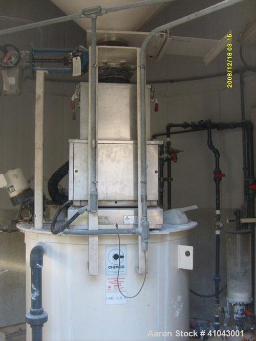 Used Chemco Dry Bulk Storage Silos. System includes 3 silos, 11' diameter x 32' tall each, stair tower and catwalks. Previously used to store and mix lime and powdered activated carbon.