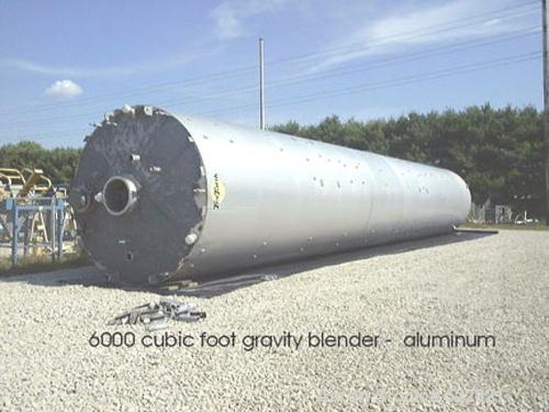 USED: 6,420 cubic foot aluminum storage bin and gravity blender, 12' diameter x 78' high skirt supported. Aluminum construction silo designed with capacity of 35 PCF material. Storage cylinder is app...