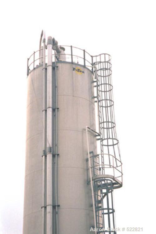 USED: 6,420 cubic foot aluminum storage bin and gravity blender, 12' diameter x 78' high skirt supported. Aluminum construction silo designed with capacity of 35 PCF material. Storage cylinder is app...