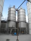 Used- Silo, 20,000 Gallon Tank. Stainless steel construction. Unit measures 11' 6" diameter x 25' straight side, with 6' dee...