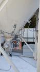 Used Belgrade Steel Tank 550 BBL Silo. 2,200 Cubic Feet Capacity. Carbon Steel. Side ladder. Cone bottom. Mounted on 4 legs. Air Lock on discharge with approximate 3/4 hp motor. Top mounted dust coll...