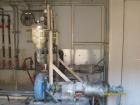 Used Chemco Dry Bulk Storage Silos. System includes 3 silos, 11' diameter x 32' tall each, stair tower and catwalks. Previously used to store and mix lime and powdered activated carbon.