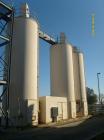 Used Chemco Dry Bulk Storage Silos. System includes 3 silos, 11' diameter x 32' tall each, stair tower and catwalks. Previously used to store and mix lime and powdered activated carbon.