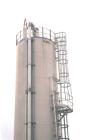 USED: 6,420 cubic foot aluminum storage bin and gravity blender, 12' diameter x 78' high skirt supported. Aluminum construction silo designed with capacity of 35 PCF material. Storage cylinder is app...