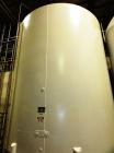 Used Mueller 5,000 Gallon Top Agitated Tank, R-22 cooling coils, mild steel exterior shell, dish top and dish bottom, bottom side manway, (8) mild steel legs, 2