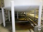 Used Mueller 5,000 Gallon Top Agitated Tank, R-22 cooling coils, mild steel exterior shell, dish top and dish bottom, bottom side manway, (8) mild steel legs, 2