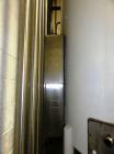 Used Mueller 5,000 Gallon Top Agitated Tank, R-22 cooling coils, mild steel exterior shell, dish top and dish bottom, bottom side manway, (8) mild steel legs, 2