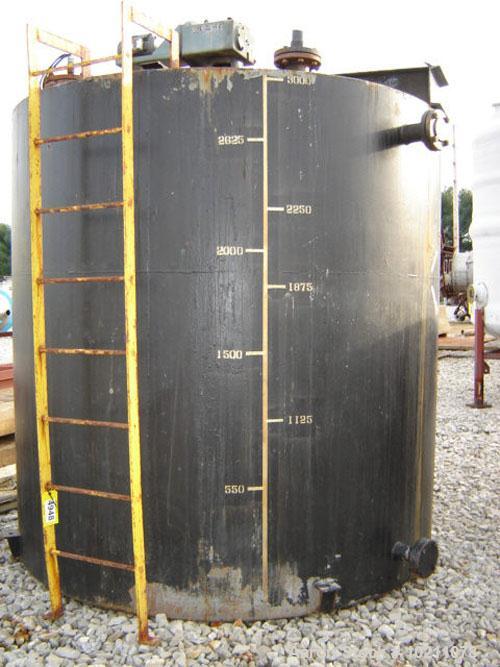 Used-3000 Gallon Mix Tank with Philadelphia Mixer, Carbon Steel Construction. Tank is 8' tall and approximately 8' in diamet...