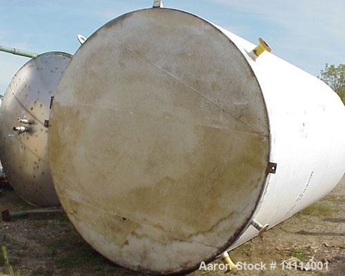 Used 9,840 US Gallon Carbon Steel Tank. Vertical, 10' diameter x 17' high (T-T). 12" dome top. Flat bottom with 3" drain. Top and bottom manway. Overall height 18'6". Top lifting lug.