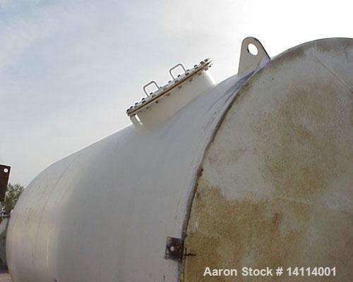 Used 9,840 US Gallon Carbon Steel Tank. Vertical, 10' diameter x 17' high (T-T). 12" dome top. Flat bottom with 3" drain. Top and bottom manway. Overall height 18'6". Top lifting lug.