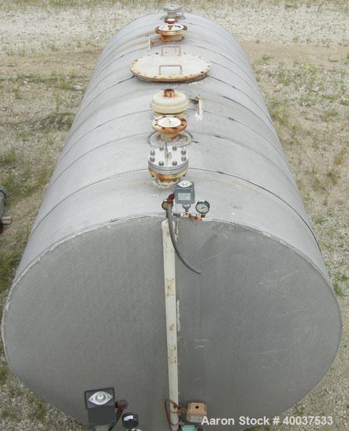 Used Brown-Minneapolis Tank, 4000 gallon, carbon steel, horizontal. Approximately 7' diameter x 14' straight side, flat ends. UL listed for above ground flammable storage. Openings top 2",4",8", 23" ...
