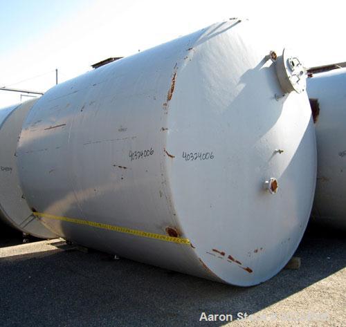 Used Tank, 8500 gallon, carbon steel,  vertical. Approximately 11' diameter x 12' straight side, dished top, flat bottom. Top manway, 4" NPT end bottom outlet.
